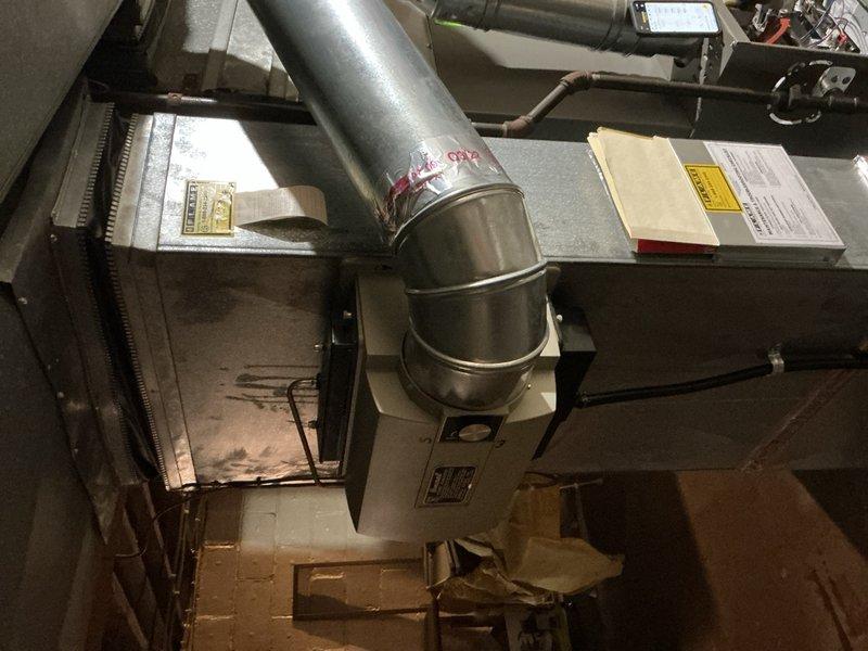 Responded to homeowner complaint of intermittent banging noise from 2023 furnace located in basement. Performed diagnostic testing using Fieldpiece meter which revealed abnormal pressure readings (33.5/32.5) in the system. Inspected blower motor assembly and adjusted fan wheel to eliminate noise issue.