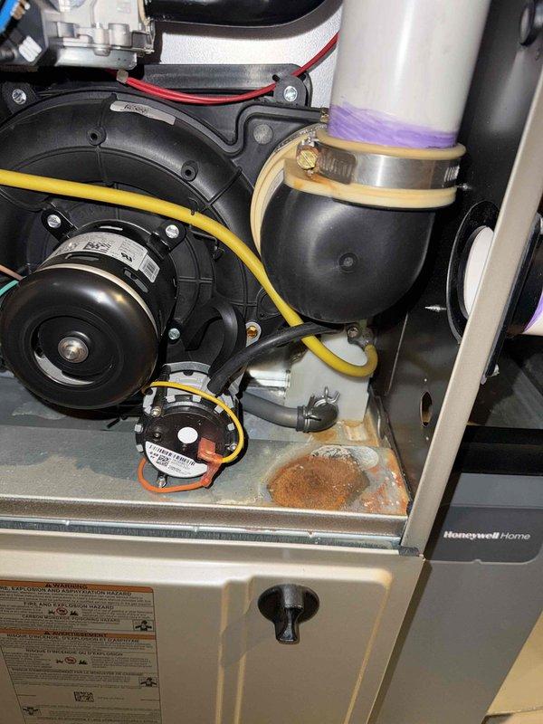 Diagnosed and repaired a malfunctioning Honeywell thermostat that was still allowing basic heating/cooling functionality. Opened unit to inspect internal circuit board (BD76), revealing corrosion on components. Replaced thermostat and verified proper system operation with the homeowner.