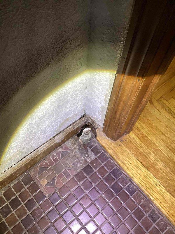 Inspected existing boiler and confirmed presence of carbon monoxide due to cracked heat exchanger, creating an unsafe condition requiring immediate replacement. Documented current installation conditions including existing plumbing connections and floor transition areas. Recommended full replacement of compromised boiler unit to restore safe heating operation and eliminate carbon monoxide hazard.