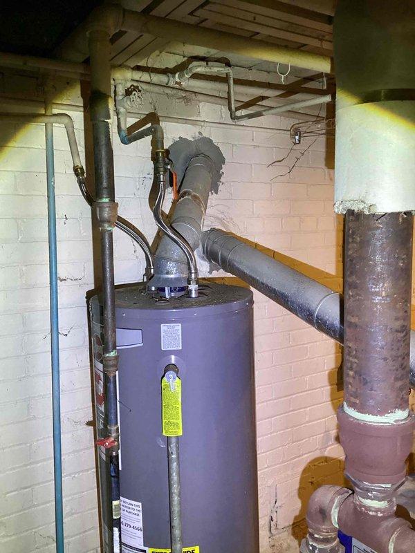 Inspected existing boiler and confirmed presence of carbon monoxide due to cracked heat exchanger, creating an unsafe condition requiring immediate replacement. Documented current installation conditions including existing plumbing connections and floor transition areas. Recommended full replacement of compromised boiler unit to restore safe heating operation and eliminate carbon monoxide hazard.