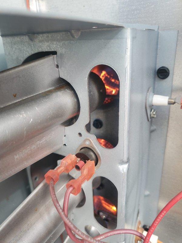 Responded to service call for 2-year-old Goodman packaged furnace that was not turning on properly and producing a humming sound. Upon inspection, discovered faulty inducer motor causing operational issues. Removed access panel, disconnected wiring, replaced inducer motor, and verified proper ignition sequence with visual confirmation of normal flame pattern. Unit now functioning correctly with no unusual noises.