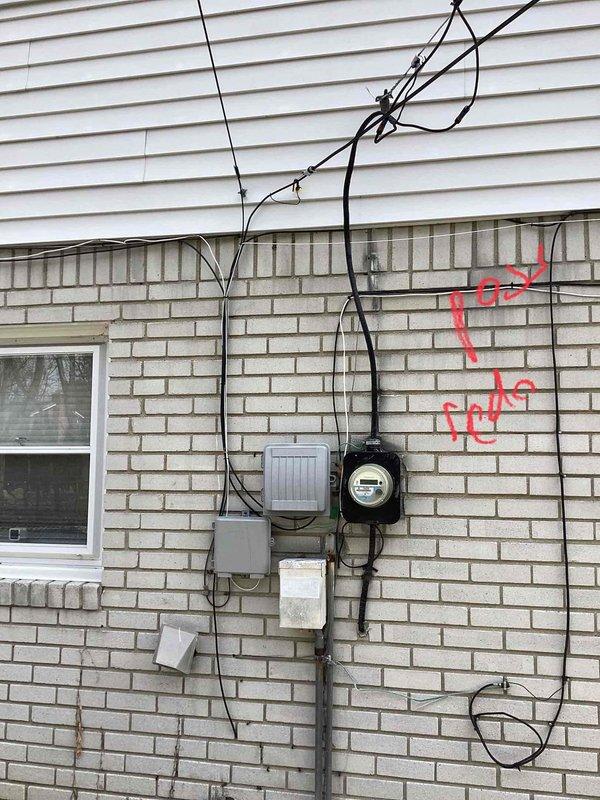 Conducted comprehensive site assessment for AC installation in a property with no existing cooling system. Inspected exterior utility connections including electrical service entrance and available mounting locations. Evaluated interior plumbing configuration with specific attention to the existing water heater vent system and identified potential AC condensate drain line connection point as marked on the utility room wall. Documented current infrastructure to determine optimal equipment placement and installation requirements for a complete HVAC system.