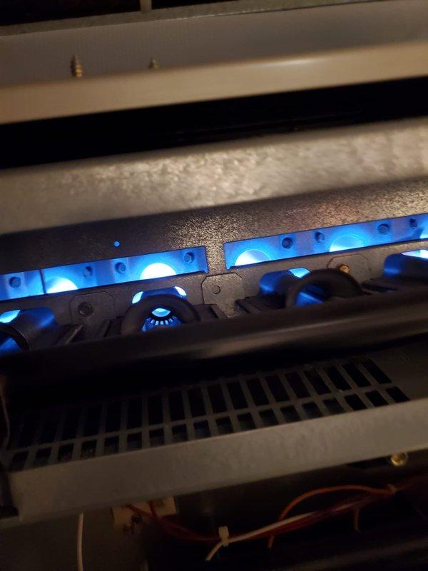 Performed diagnostic testing on 1990 furnace that was not producing heat. Combustion analyzer readings showed optimal O2 (0.1%), CO (4 PPM), and CO2 (8.4%) levels with proper flame pattern observed. Successfully restored heating function after cleaning ignition sensor that customer had previously attempted to service, bringing house temperature up from 61°F.