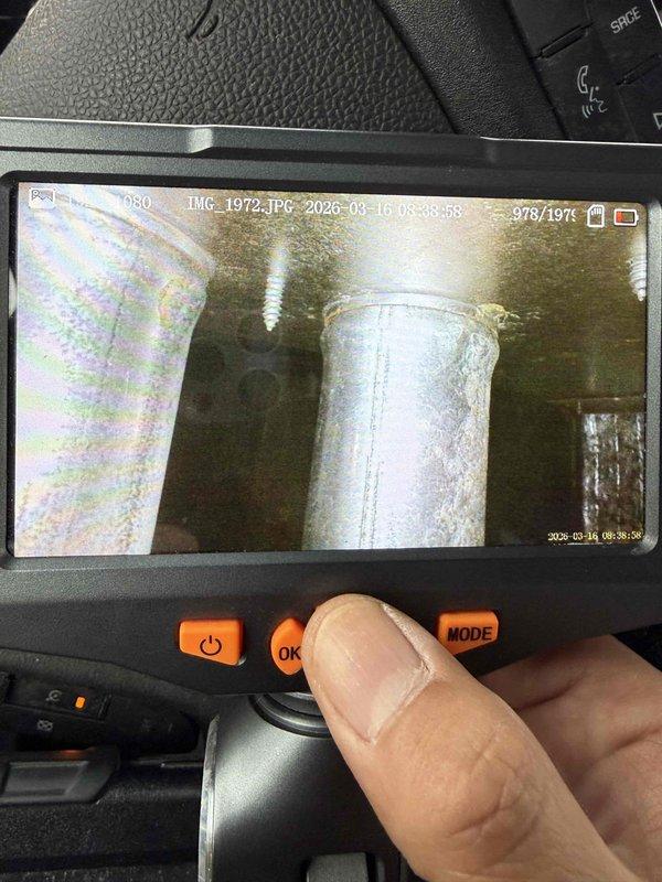 Responded to service call for non-operational furnace displaying error code L5. Inspection revealed severely rusted and corroded burners with significant oxidation damage, typical of an aging system (15 years). Visual inspection with diagnostic camera confirmed internal heat exchanger deterioration, indicating end-of-life condition requiring replacement recommendation.