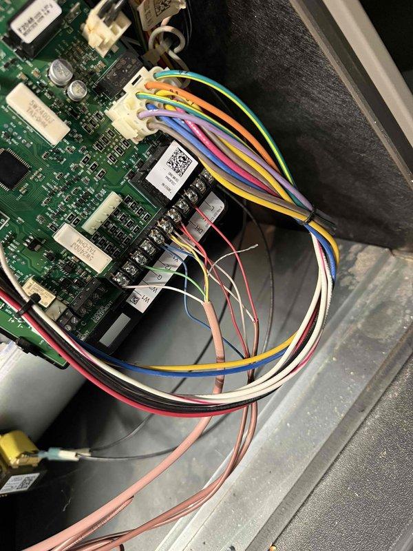 Responded to service call for non-functional thermostat. Diagnosed failed circuit board on 5-year-old Lennox thermostat located in living room. Removed existing unit, installed new compatible thermostat, and verified proper connection of all control wiring (R, Y, W, G terminals) to ensure proper system functionality.