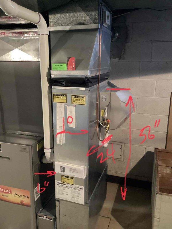 Conducted diagnostic assessment on Bryant Plus 90i furnace exhibiting temperature inconsistency and noise issues. Identified failed control board and signs of secondary heat exchanger deterioration in the approximately 10-year-old unit located in basement. Documented existing installation measurements and exhaust ventilation configuration for replacement recommendation.