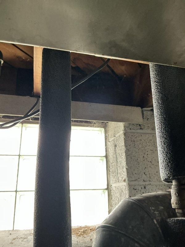 Conducted assessment for replacement of 50-year-old furnace located in basement. Inspected existing White-Rodgers thermostat and examined current HVAC infrastructure including insulated piping and ductwork. Documented condition of aging system to prepare comprehensive replacement estimate.