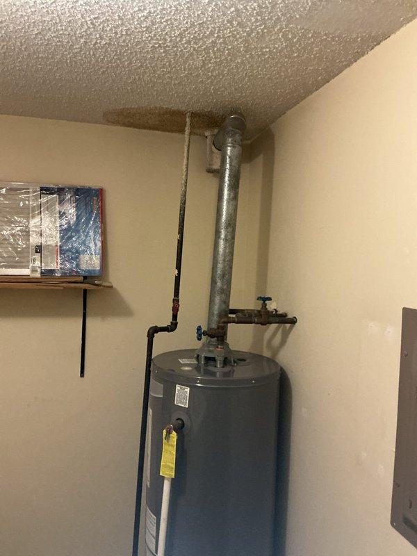 Responded to service call for water tank leak in laundry room. Upon inspection, replaced faulty water heater with new unit, installed proper ventilation pipe to ceiling, and connected all required copper piping with appropriate shut-off valves. System was tested and confirmed to be functioning correctly with no leaks present.