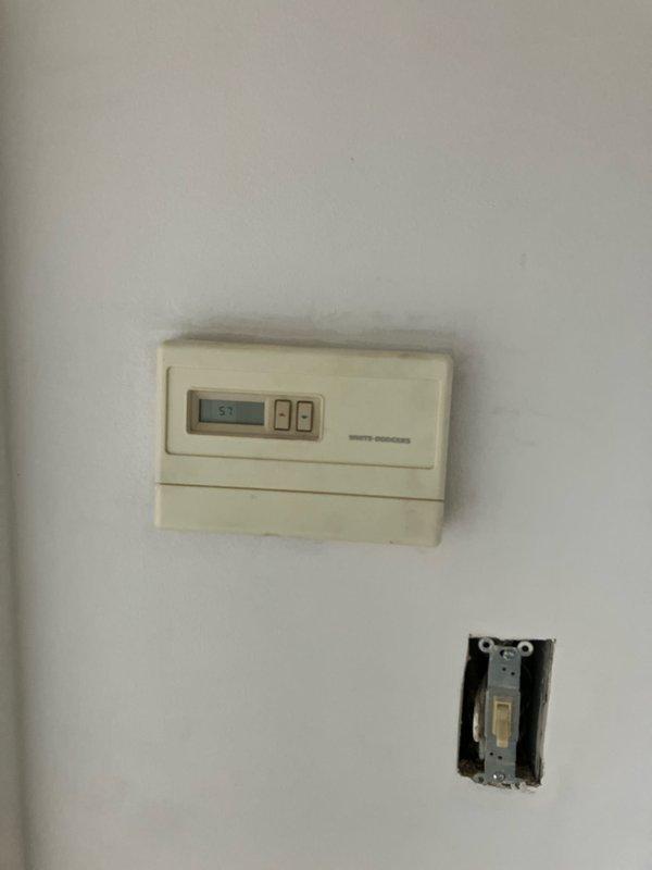 Conducted a comprehensive evaluation for replacement of 10+ year old non-operational furnace and AC system located in customer's basement. Natural gas-fueled system requires full replacement. Observed existing outdoor unit wrapped in protective tarp and documented current thermostat (White-Rodgers model) reading at 57 degrees. Customer appointment scheduled for afternoon arrival (after 1PM).