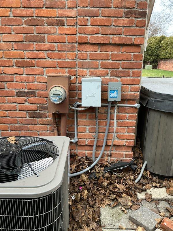 Conducted site evaluation for a new generator installation at customer's residence. Installation location was identified alongside the existing air conditioning unit on the right side of the house. Completed assessment of the electrical service panel and natural gas availability for proper generator sizing and connection requirements. Documented existing utility configurations and space constraints to ensure appropriate equipment specifications for the upcoming installation.