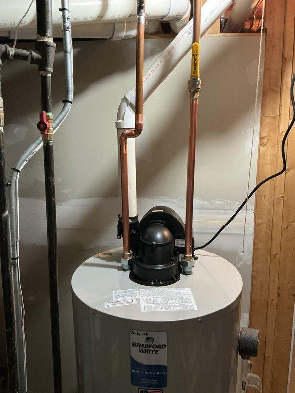 Installed new 50-gallon Bradford White water heater with proper copper and PVC connections. Completed all necessary plumbing connections including pressure relief system with brass valves. Customer renewed gold plan membership with applicable discount applied to water heater.
