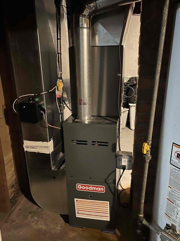 Responded to service call for uneven heating in residence with 8-month-old Goodman furnace located in basement. Diagnosed airflow distribution issue causing excessive heat in upstairs bathroom while basement remained cold. Adjusted dampers and balanced system to improve temperature consistency throughout home.