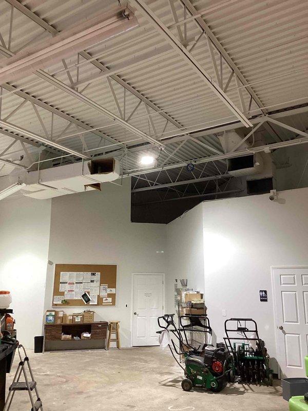 Performed site assessment for RTU replacement estimate on a 2001 Lennox unit with failed heat exchanger. Documented existing electrical panel configuration and commercial workspace layout with photos. Confirmed roof access requirements for future installation work.