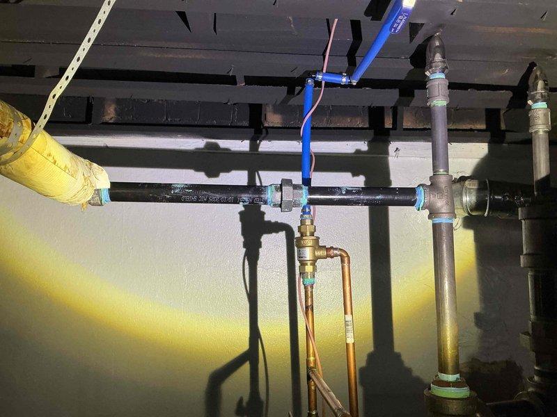 Completed comprehensive repair of boiler pipe system in utility area. Addressed and replaced compromised sections of both black metal and copper piping, installing new brass fittings and valves to ensure proper flow. Successfully restored full functionality to the heating system with all connections properly sealed and tested.