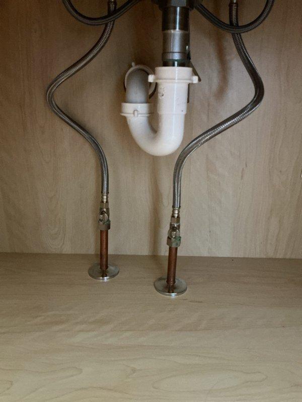 Successfully installed new customer-supplied lavatory faucet in bathroom. Properly connected hot and cold water supply lines with braided stainless steel connectors to existing copper pipes and secured PVC P-trap drain assembly. All connections tested with no leaks detected and proper water flow confirmed.