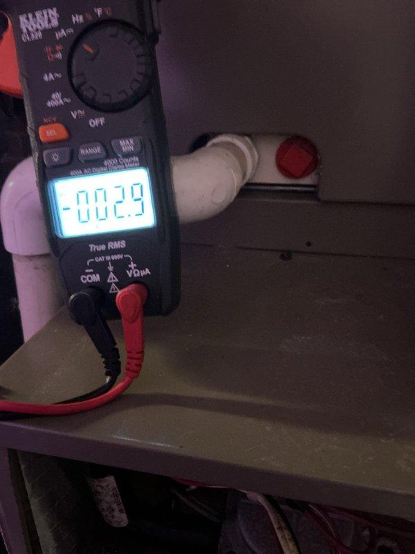 Responded to no-heat call for Lexair furnace less than 10 years old located in basement. Diagnostic testing with multimeter revealed negative voltage readings (-2.9V) at control board. Inspected venting system and identified minor condensate leak at PVC pipe joint, which was sealed to prevent further moisture damage. Replaced faulty control board to restore proper furnace operation and verified system functionality before completing service.