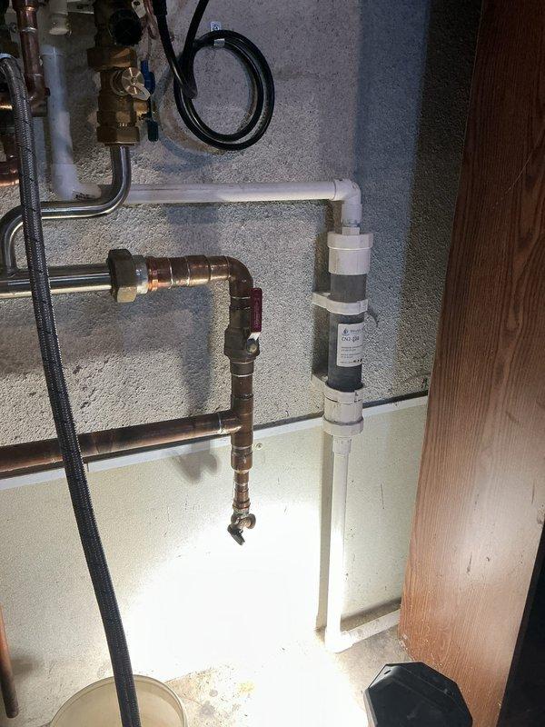 Performed preventative maintenance on Navien tankless water heater system, including comprehensive system flush to remove mineral buildup and replacement of condensate neutralizer to prevent acidic discharge damage. Inspected all copper piping connections, expansion tank, and pressure components, confirming proper operation of the complete installation with no leaks or pressure issues detected.