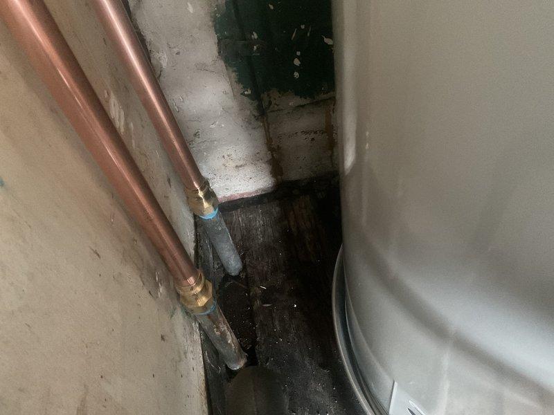 Successfully installed a 40-gallon tall water heater in a confined utility space. Properly connected copper supply lines with brass fittings and installed galvanized steel vent piping with secure joints. Verified all connections were leak-free and system was functioning correctly before completing the installation.
