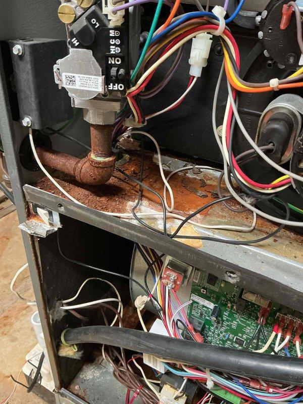 Successfully installed a 4-ton A/C unit and coil, completing all required refrigerant and electrical connections. Replaced aging components showing significant oxidation and corrosion, particularly on copper lines and metal surfaces. System now operational with all wiring properly connected to control board and blower assembly.