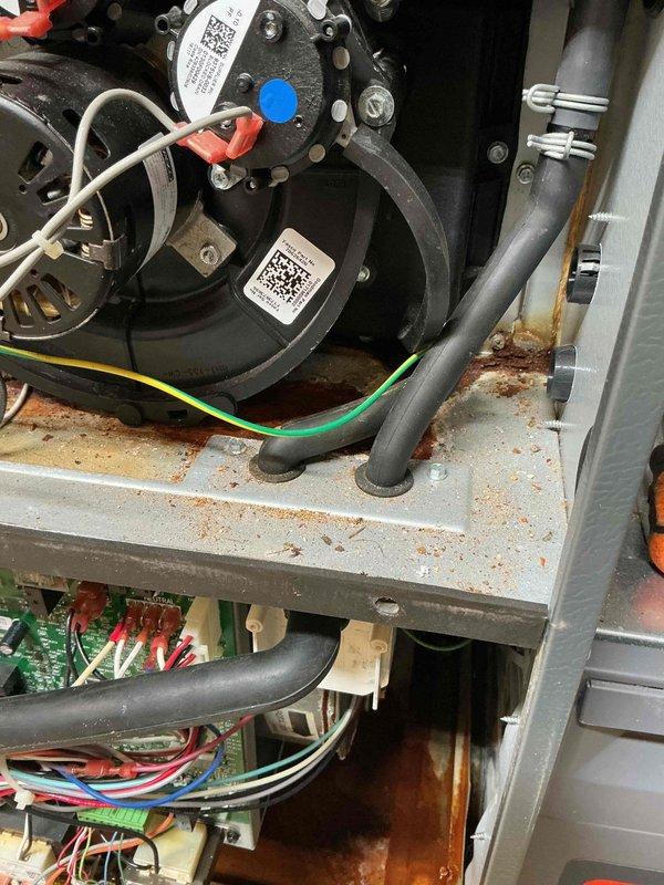 Successfully installed a 4-ton A/C unit and coil, completing all required refrigerant and electrical connections. Replaced aging components showing significant oxidation and corrosion, particularly on copper lines and metal surfaces. System now operational with all wiring properly connected to control board and blower assembly.