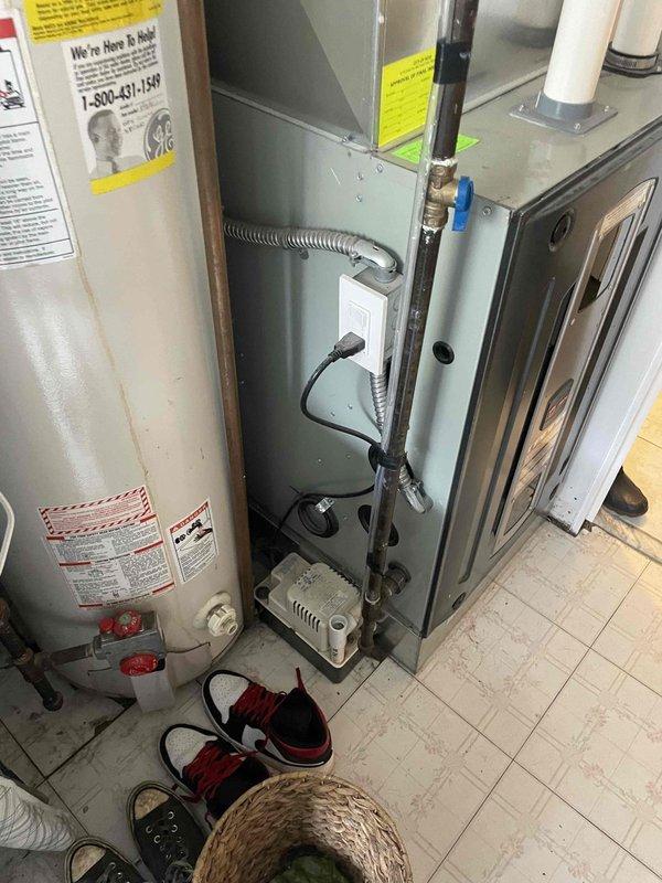 Conducted site assessment for AC installation at commercial location with existing gas furnace and water heater in utility room. Evaluated space constraints and existing mechanical systems to determine appropriate equipment specifications. Customer requires new AC system installation with no existing cooling infrastructure present.