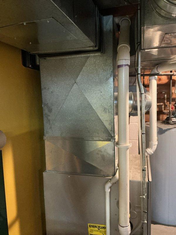 Conducted diagnostic assessment on 10-year-old furnace with failing control board, which was causing fan to operate only on low speed. System still maintained heating/cooling functionality despite the issue. Documented electrical panels and HVAC installation in basement for replacement estimate. Recommended control board replacement due to age of unit and ongoing performance limitations.