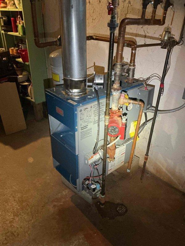 Responded to emergency no heat call for aging residential heating system with significant corrosion at circulation pump connections. Diagnosed failed aquastat relay and deteriorated dielectric union. Replaced aquastat relay, dielectric union, and installed new nipple tray to restore system operation and prevent future galvanic corrosion issues.