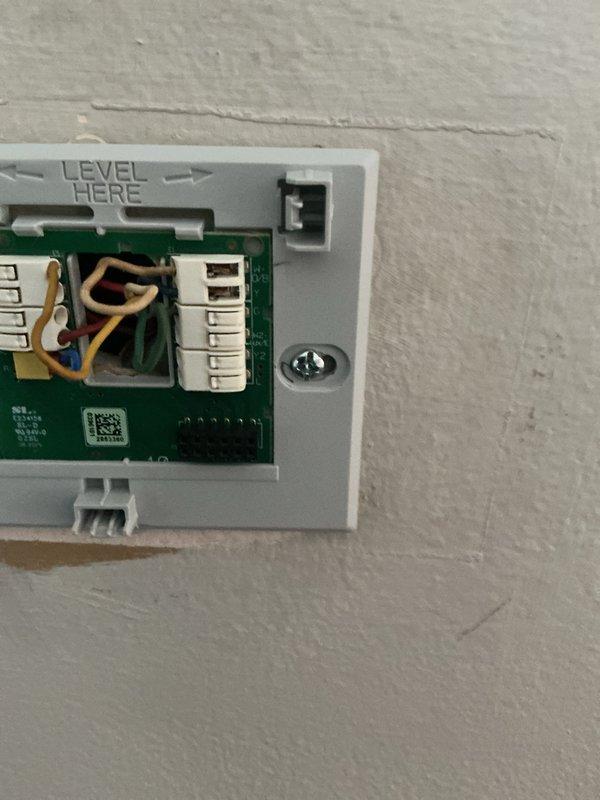 Responded to callback regarding thermostat control issues with humidifier. Inspected existing 5-year-old thermostat in living room which was non-functional. Removed and replaced thermostat, ensuring proper wiring connections and level installation. Verified proper operation of new unit and confirmed humidifier control functionality was restored.