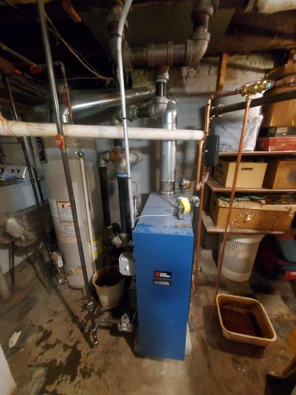 Performed routine inspection of 2-year-old boiler system. Verified proper water level in sight glass indicator and checked all brass valves and fittings for integrity. Examined exhaust ventilation, PVC connections, and copper piping throughout the system with no issues identified. System is functioning properly and within normal operational parameters.