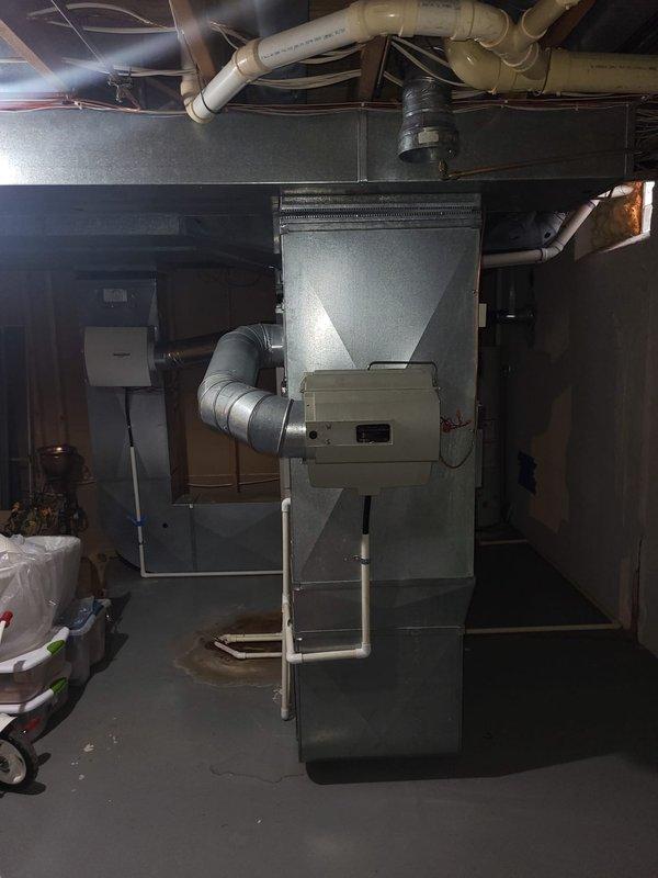 Conducted comprehensive assessment of 18-year-old furnace located in basement for potential replacement. Inspected electrical panel for compatibility with new system requirements and examined existing ductwork configuration. Documented current installation conditions to prepare detailed replacement estimate for aging HVAC system.