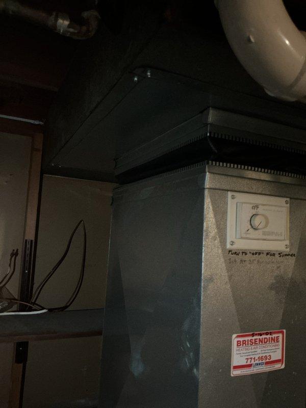 Conducted assessment of non-operational electric furnace in residential property. Unit appears to be older model Brisendine system with standard ductwork configuration and PVC condensate drainage. Recommended complete replacement due to age and failure status. Photos documented current installation setup in utility area for proper replacement specifications.