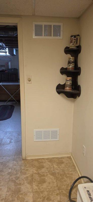 Resolved City mechanical violation by installing a 14"x6" register in the lower section of the mechanical room wall to provide proper combustion air ventilation per code requirements. Documented installation with photos showing the completed register placement and surrounding area to confirm compliance with inspector's specifications.