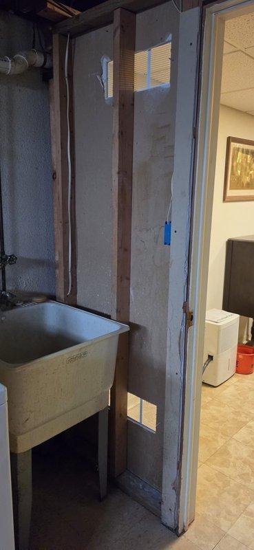 Resolved City mechanical violation by installing a 14"x6" register in the lower section of the mechanical room wall to provide proper combustion air ventilation per code requirements. Documented installation with photos showing the completed register placement and surrounding area to confirm compliance with inspector's specifications.