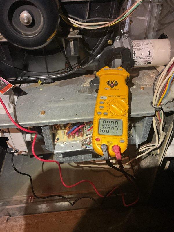 Performed Gold Furnace Inspection on 24-year-old basement furnace. Conducted electrical diagnostic testing with UEi clamp meter on blower motor and verified proper amperage readings. Inspected capacitor and wiring connections throughout system. Also noted Bradford White water heater in utility area during service visit.