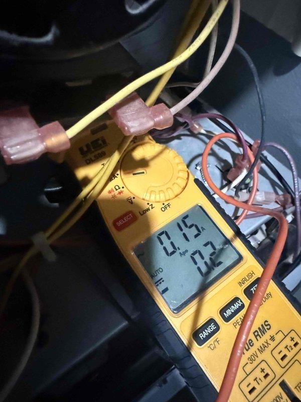Responded to no heat complaint on 7-year-old furnace located in basement. Diagnostic testing with digital multimeter revealed low amperage readings (0.75, 0.2, 0.15, 20.1) across system components. Identified and corrected electrical issue causing unit to cycle on and off intermittently, restoring proper operation.