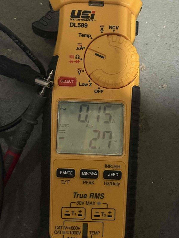 Responded to no heat complaint on 7-year-old furnace located in basement. Diagnostic testing with digital multimeter revealed low amperage readings (0.75, 0.2, 0.15, 20.1) across system components. Identified and corrected electrical issue causing unit to cycle on and off intermittently, restoring proper operation.