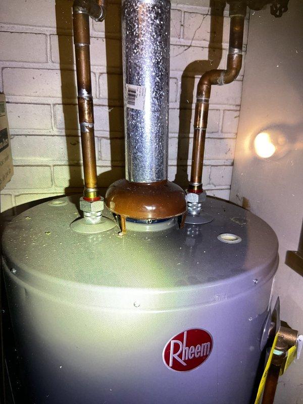 Performed scheduled tune-up on customer's Rheem hot water heater (under 10 years old) located in first floor utility area. Inspected unit for proper operation, checked connections and verified no leaks in copper supply lines. Utilized hex key tool to make minor adjustments during service. System is operating within normal parameters.