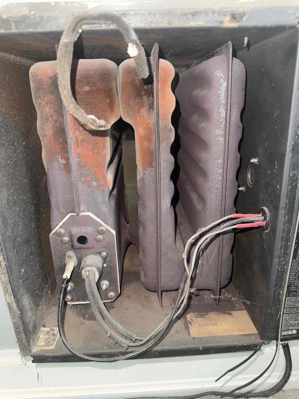 Diagnosed 20+ year old furnace with ignition failure. Discovered heavily corroded heat exchanger fins and faulty ignition sensor. Replaced ignition sensor and tested system operation, but recommended full furnace replacement due to age and extensive heat exchanger deterioration posing safety concerns.