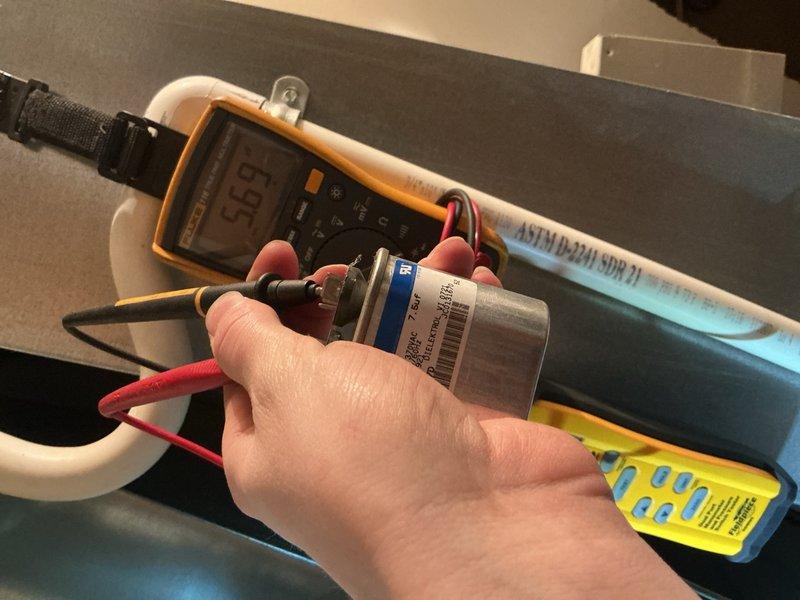 Performed comprehensive tune-up on 18-year-old furnace located in main floor closet. Conducted electrical diagnostics using multimeter, measuring voltage readings (696) across components with specialized probes. Completed temperature differential testing with Fieldpiece meter, recording supply/return temperatures (32°F/12°F) to verify proper system operation.