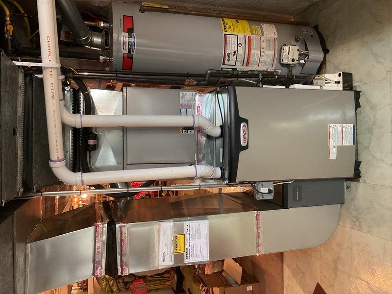 Completed installation of a 90,000 BTU Lennox furnace with proper mechanical and electrical connections. System includes integration with existing S40 thermostat and condensate pump, with repairs made to address water leak. All PVC venting properly secured with connections to existing ductwork, and system verified operational with appropriate rebate documentation processed.