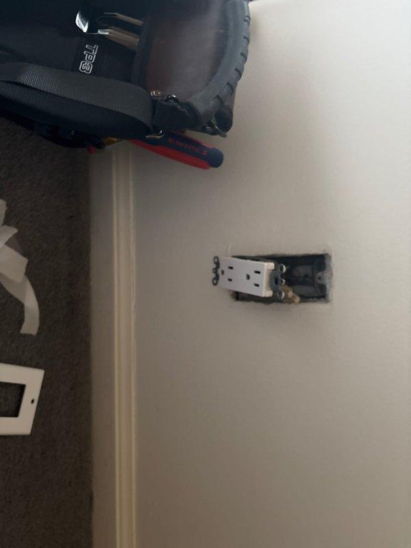 Responded to service call regarding a loose outlet plate in first floor bedroom. Upon inspection, found the electrical outlet was partially detached from the junction box due to aggressive unplugging. Secured the outlet properly in the wall junction box and verified proper function by testing with customer's existing plugged device.