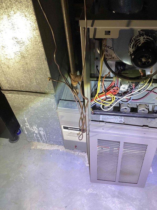 Performed inspection of 26-year-old furnace with non-functional blower motor and confirmed cracked heat exchanger. System is completely inoperable for both heating and cooling functions. Provided comprehensive replacement estimate for new furnace installation to replace aging basement unit that has reached end of serviceable life.