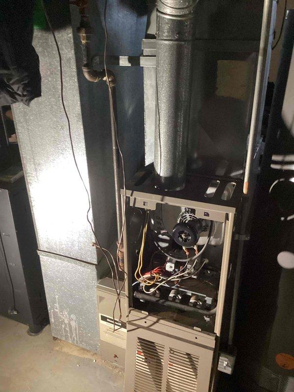 Performed inspection of 26-year-old furnace with non-functional blower motor and confirmed cracked heat exchanger. System is completely inoperable for both heating and cooling functions. Provided comprehensive replacement estimate for new furnace installation to replace aging basement unit that has reached end of serviceable life.