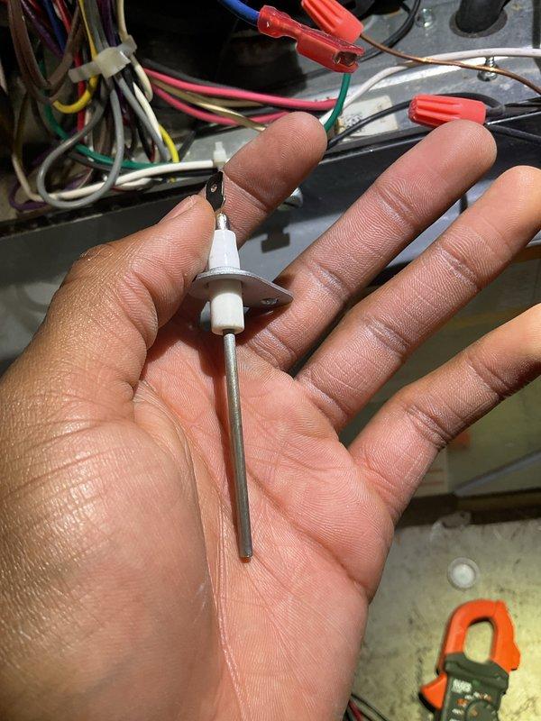 Performed Gold Furnace Inspection on operational furnace under 10 years old located in basement. Inspected igniter/sensor probe and verified proper electrical connections. Observed burner assembly with clean blue flame pattern indicating correct combustion and proper system operation.