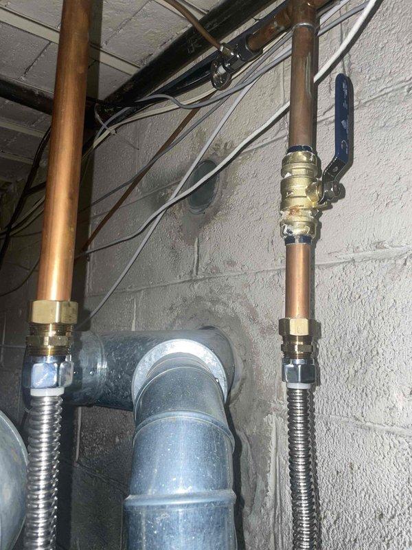 Provided estimate for replacement of 10+ year old AC unit and hot water tank located in basement. Current equipment is operational but showing signs of aging. Inspection revealed moisture damage around plumbing connections with visible water staining on walls, deterioration of trim with black mold presence, and potential water leakage affecting the surrounding infrastructure. Natural gas is available for replacement equipment.