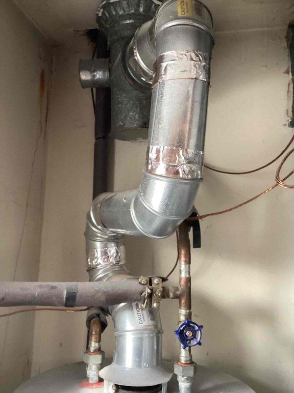 Performed assessment for converting existing Lochinvar tank water heater system to tankless hot water heater as requested by customer. Current tank unit is non-operational. Evaluated existing plumbing configuration including copper supply lines, ventilation requirements, and available utility connections to determine feasibility of tankless installation.