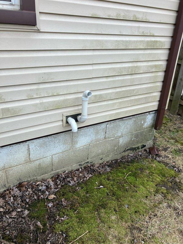 Conducted inspection of 16-year-old furnace system exhibiting abnormal inducer motor noise, poor overall performance, and a failed secondary heat exchanger with visible corrosion and rust damage. Also evaluated existing AC unit and humidifier for potential replacement. Documented exterior conditions including drainage/ventilation components and verified current system operation via Bryant Evolution thermostat.