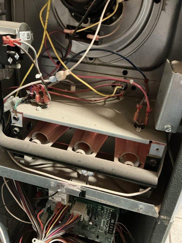 Responded to no-heat call for furnace displaying fault code. Inspected internal components including circuit board with illuminated red indicator light, heat exchanger, and wiring connections. Diagnosed and repaired faulty control board causing system failure, restoring proper heating operation.