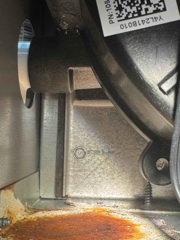 Responded to service call for a 2-year-old furnace reported with incorrect power interrupt installation, failing inducer motor, and leak. Inspection confirmed inducer motor drawing 0.26 amps, which is below normal operational parameters. Visual examination revealed significant corrosion and rust on internal components, consistent with reported leak issue. Documented findings with detailed photos of affected components and electrical measurements for service record.