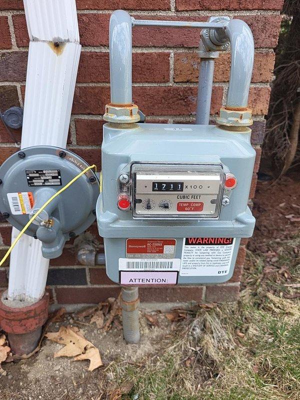 Conducted site evaluation for Kohler generator installation, documenting existing gas meter configuration and electrical panel capacity. Inspected 200A service panel with approximately 10-12 breakers to determine available space for generator transfer switch integration. Gas meter assessment confirmed current service type for proper generator fuel supply planning.